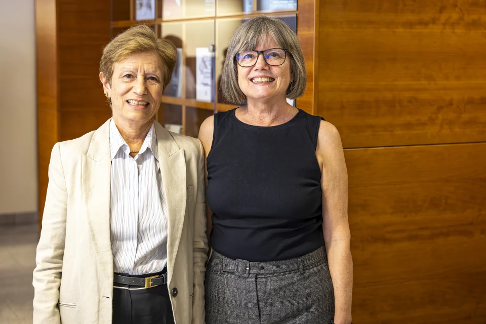 SLU-Madrid Names First Professors Emeritae Encinar (left) and McCabe (right) pose for photo during reception in San Ignacio Hall.