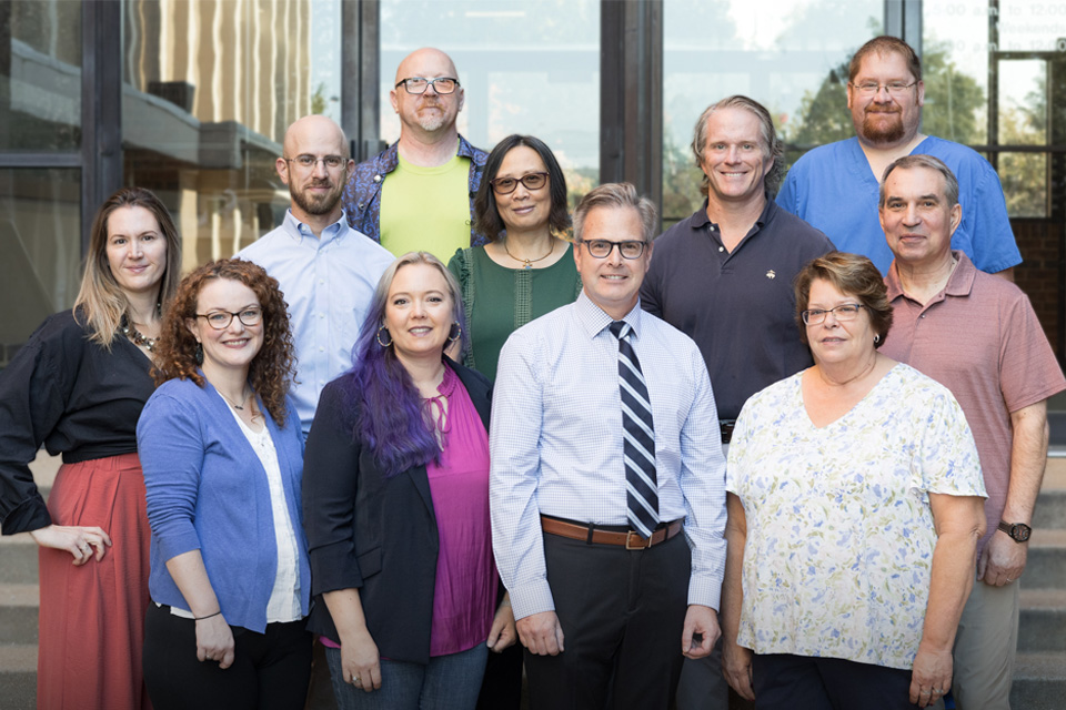 2024 - 2025 CASE Faculty standing on the steps of the Learning Resource Building at Saint Louis University School of Medicine