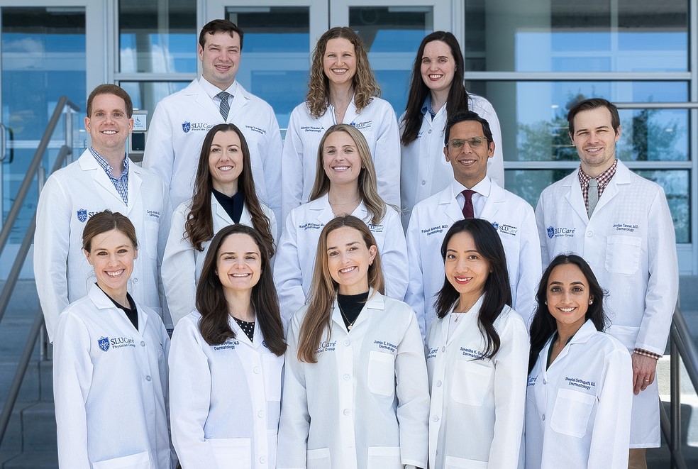 Dermatology resident A group photo of the Dermatology residents posing on a set of exterior stairs.