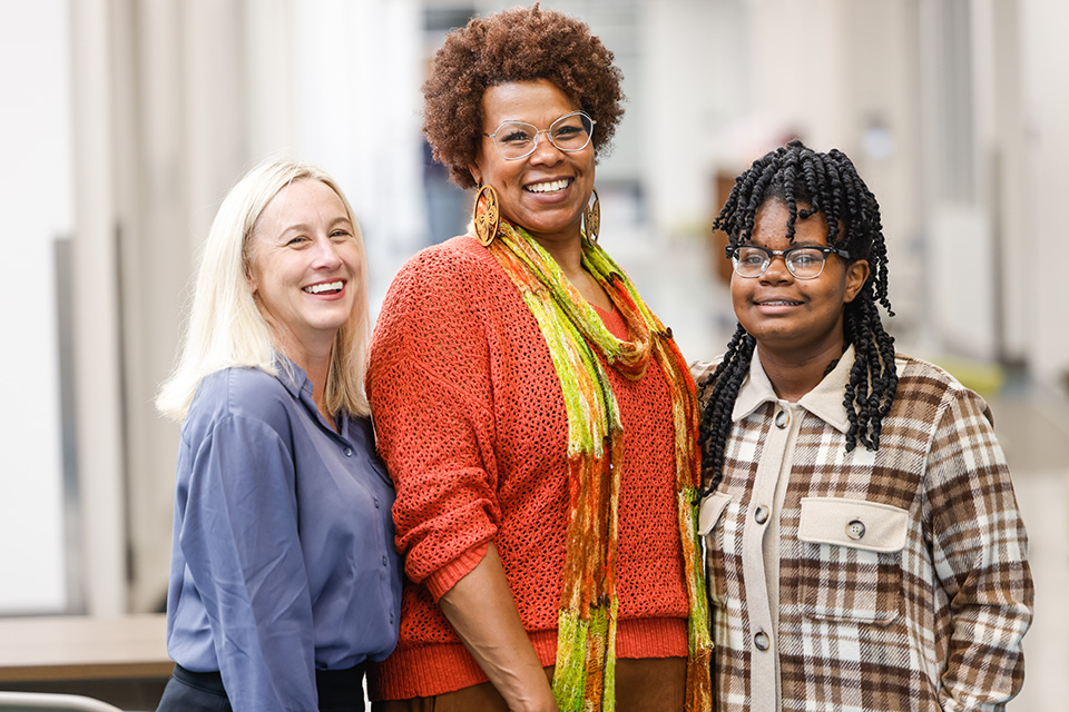 SLU Speech-Language Pathologist Christine Rose, left, with Jamie Saunders-Anglin, center, and her daughter Octavia at City Garden Montessori on Nov. 3, 2022. Photo by Sarah Conroy. SLU Speech-Language Pathologist Christine Rose, left, with Jamie Saunders-Anglin, center, and her daughter Octavia at City Garden Montessori on Nov. 3, 2022. Photo by Sarah Conroy.