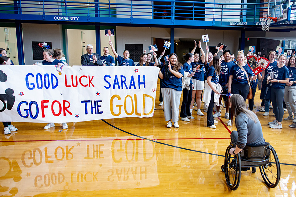 A group of people celebrate Sarah Adam.