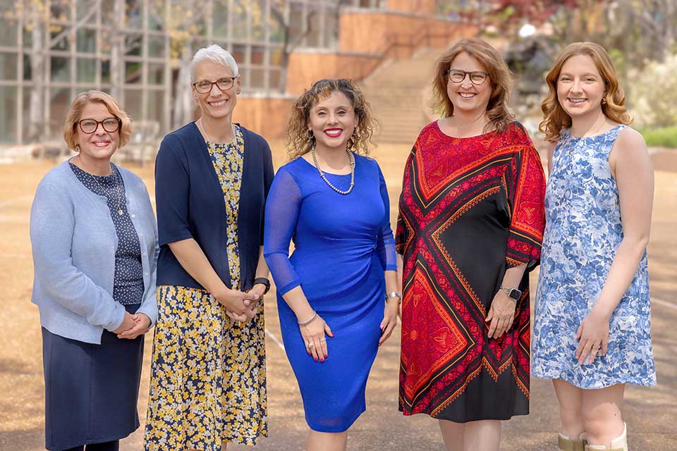 a group of women posing for a photo